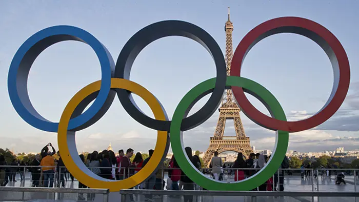 FILE - The Olympic rings are set up at Trocadero plaza that overlooks the Eiffel Tower in Paris on Sept. 14, 2017. The United States and China are expected to finish 1-2 in the gold and the overall medal counts at the Paris Olympics, which open in 100 days. (AP Photo/Michel Euler, File)